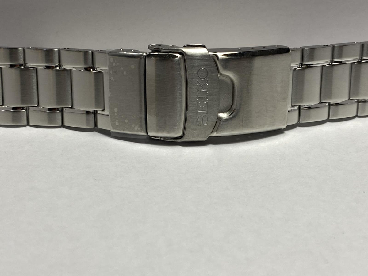 Seiko Original Watchband/Bracelet SRPE99.Solid Steel w/Logo Push Button Buckle.