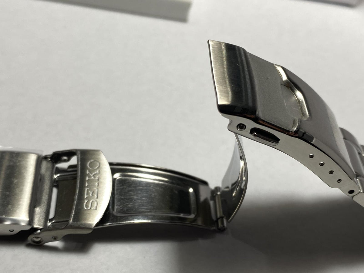 Seiko Original Watchband/Bracelet SRPE99.Solid Steel w/Logo Push Button Buckle.