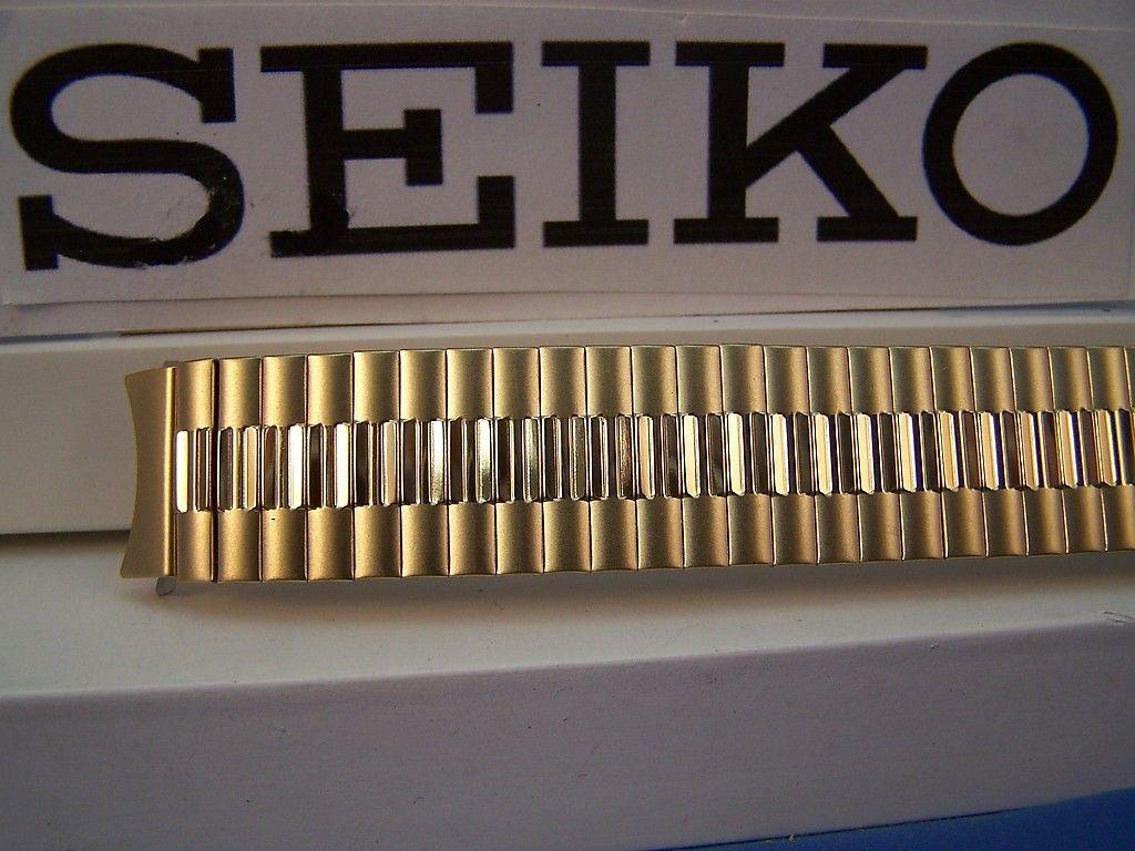 Seiko WatchBand Back Plate# 7N43-8A89 18mm gold tone Stretch Band w/Curved End